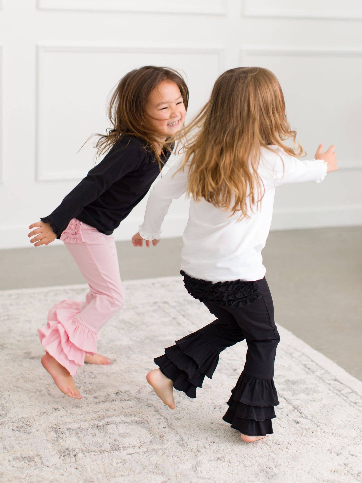 Toddler Girls Black Ruffle Flare Pants with Signature Rear Ruffles
: Black / 12-18m