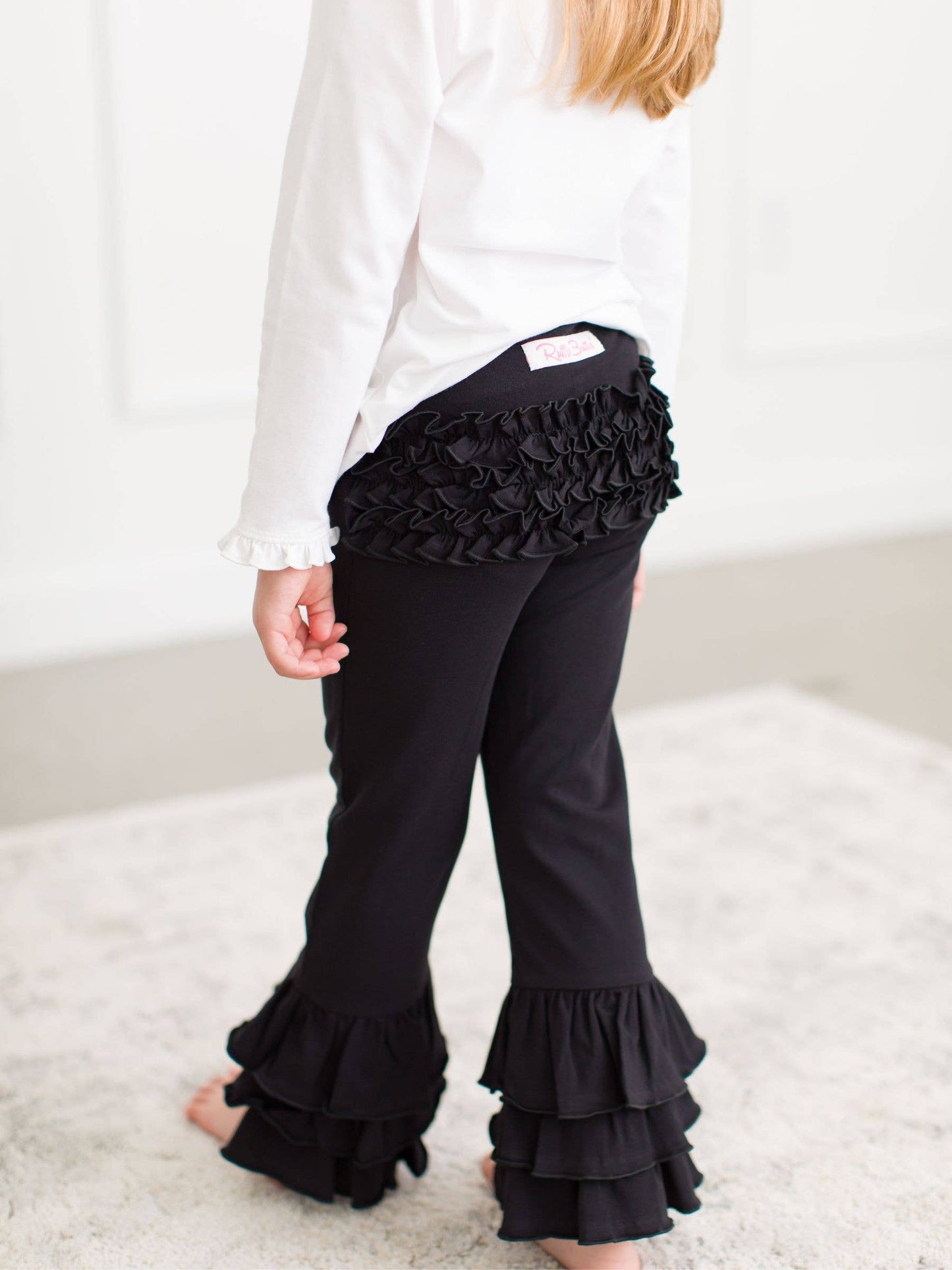 Toddler Girls Black Ruffle Flare Pants with Signature Rear Ruffles: Black / 12-18m
